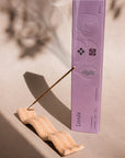 Elongated tray incense holder with imprinted wave pattern. The Wave of Senses symbolizes the undulating motion made by incense fragrance as it disperses throughout the room. The Wave holds the incense stick and catches ash as it falls.