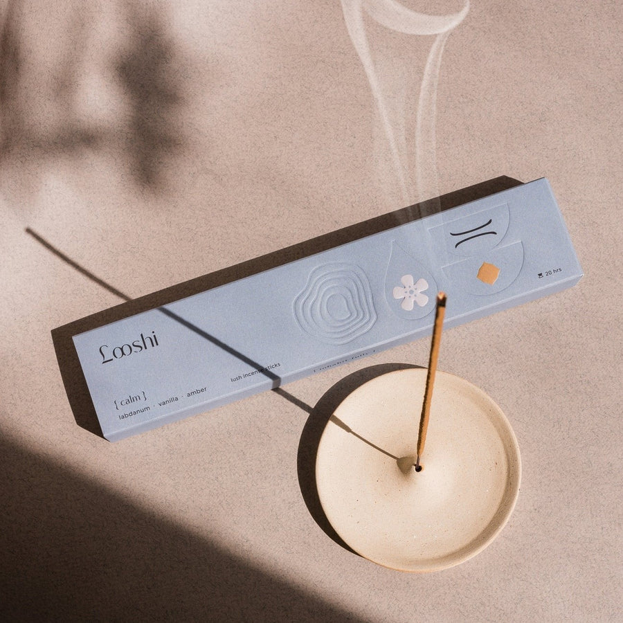 Calm incense box with a lit stick in the Ring of Serenity ceramic holder